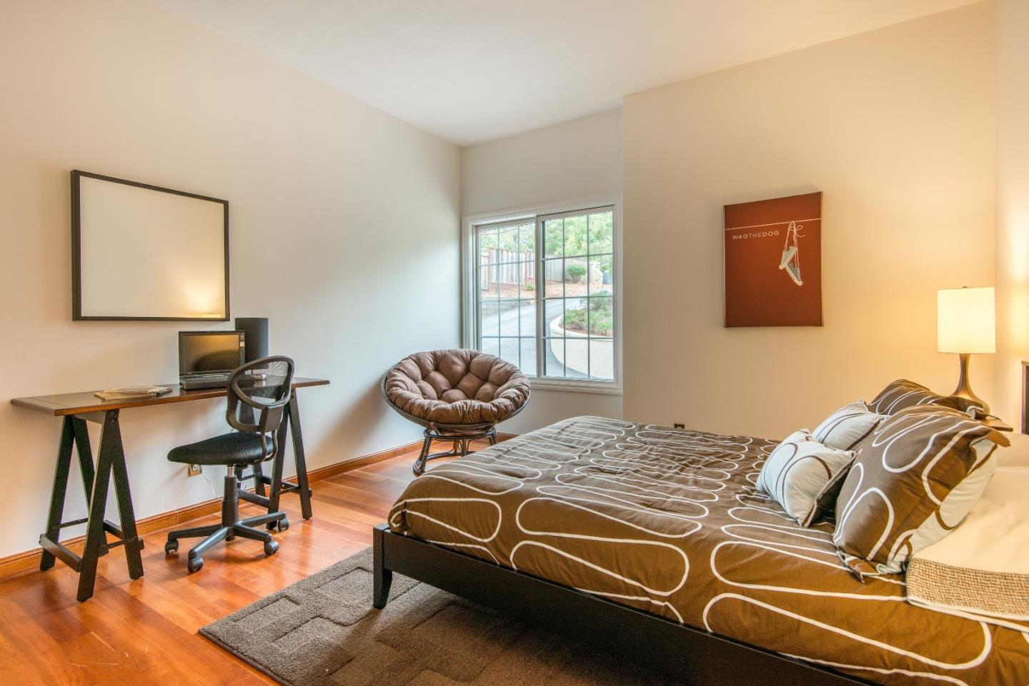 760 Darrell Road Hillsborough, CA 94010 - Photo 25 of 35 a bedroom with a bed and a desk