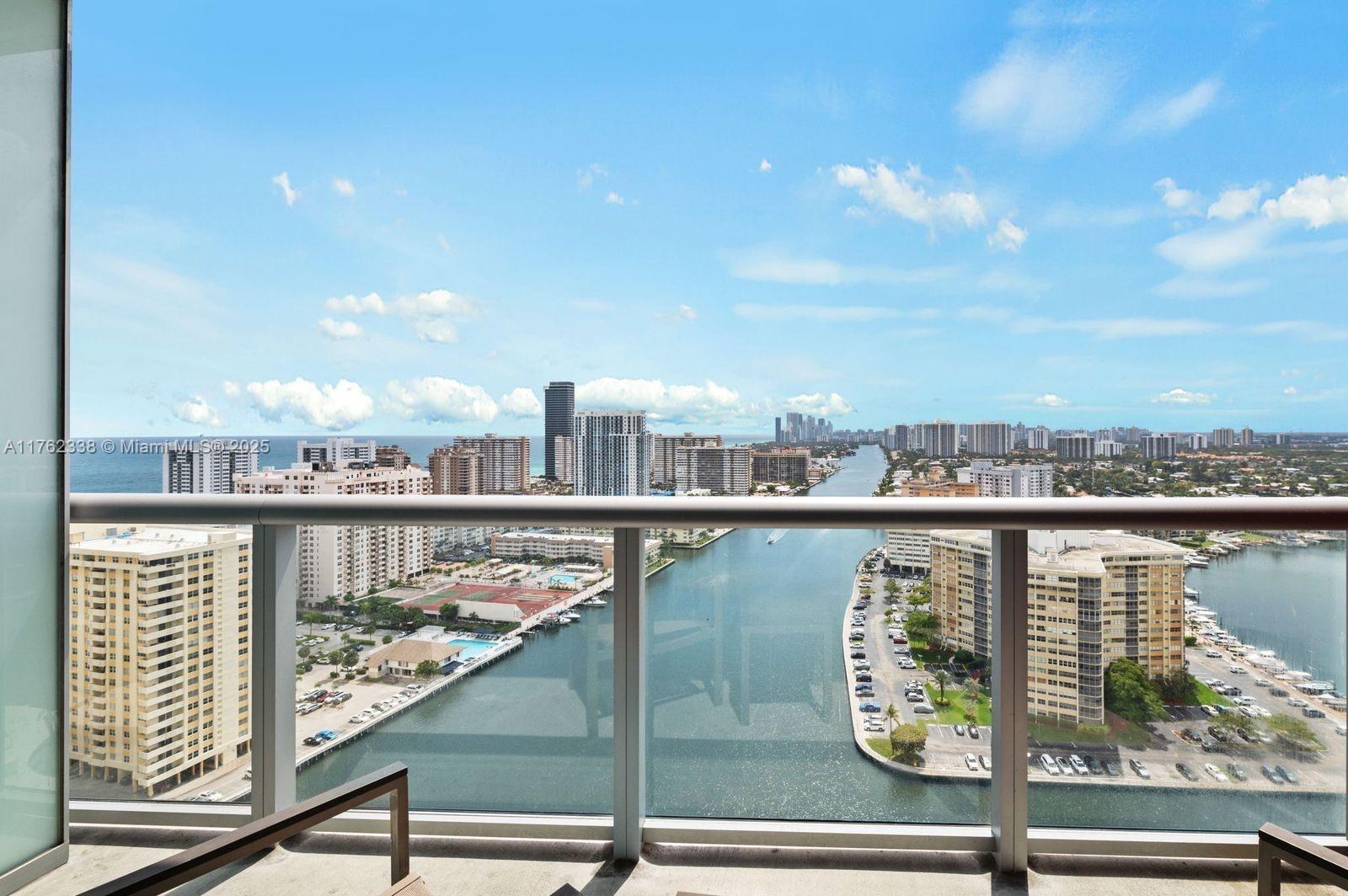 2602 East Hallandale Beach Boulevard, Unit R2703 Hallandale Beach, FL 33009 - Photo 1 of 50 a view of a balcony next to a lake view