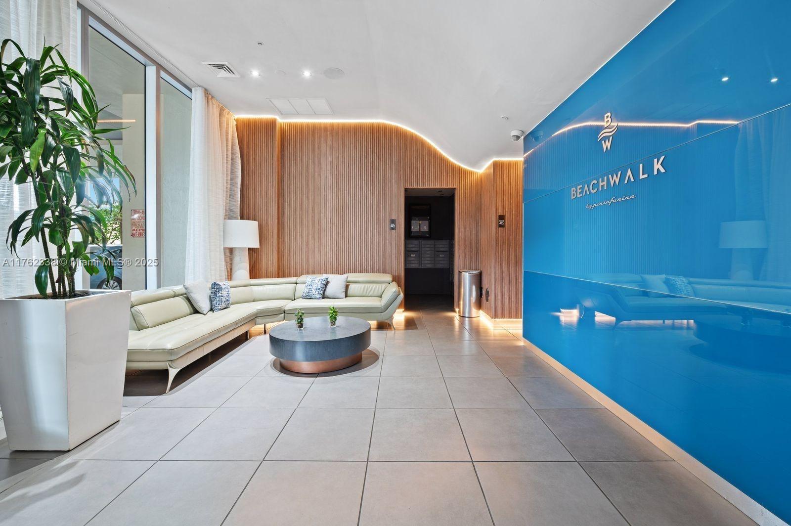 2602 East Hallandale Beach Boulevard, Unit R2703 Hallandale Beach, FL 33009 - Photo 11 of 50 a living room with patio furniture and a potted plant