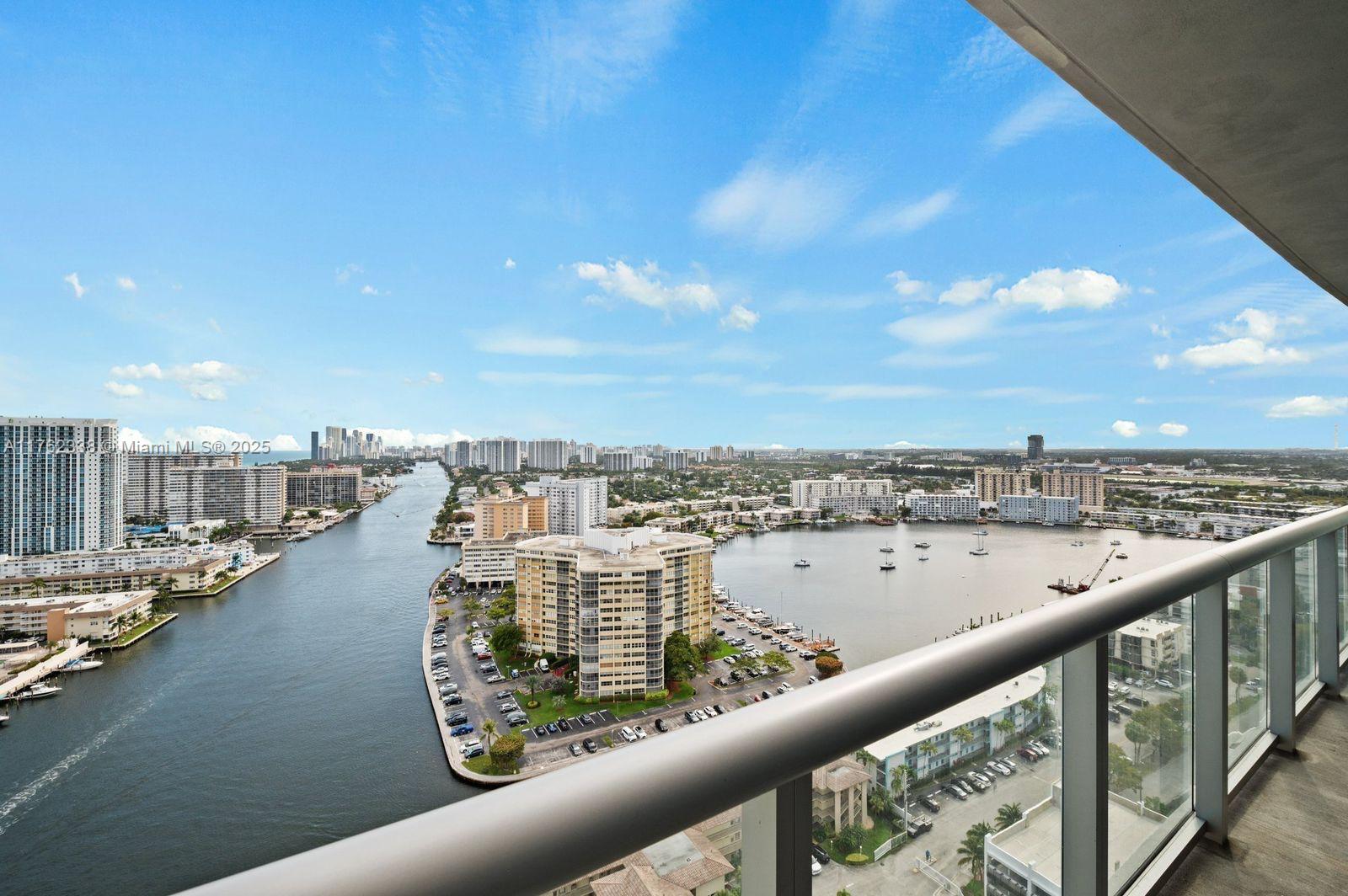 2602 East Hallandale Beach Boulevard, Unit R2703 Hallandale Beach, FL 33009 - Photo 17 of 50 a view of a city skyline from a balcony