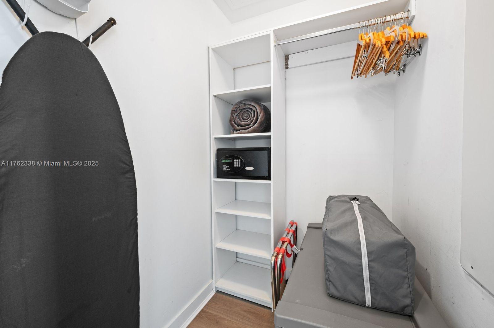 2602 East Hallandale Beach Boulevard, Unit R2703 Hallandale Beach, FL 33009 - Photo 42 of 50 a view of walk in closet with clothes and shoes