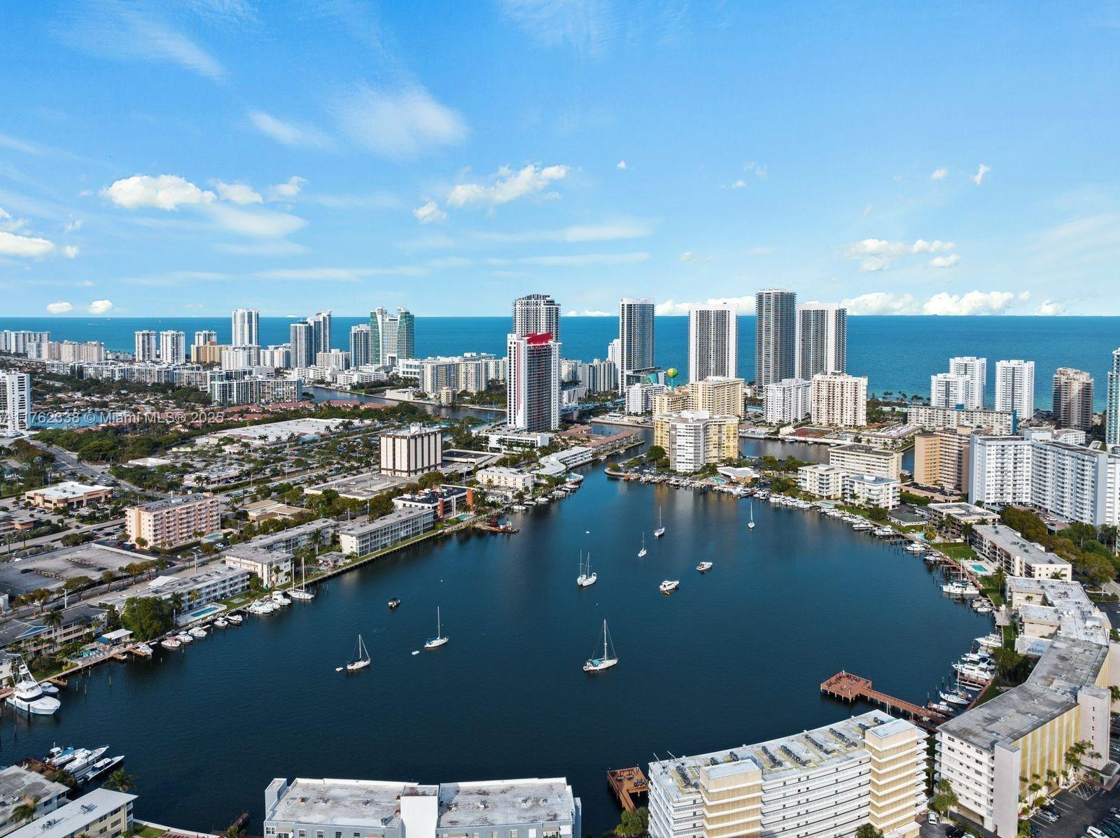 2602 East Hallandale Beach Boulevard, Unit R2703 Hallandale Beach, FL 33009 - Photo 48 of 50 a view of a terrace with lawn chairs