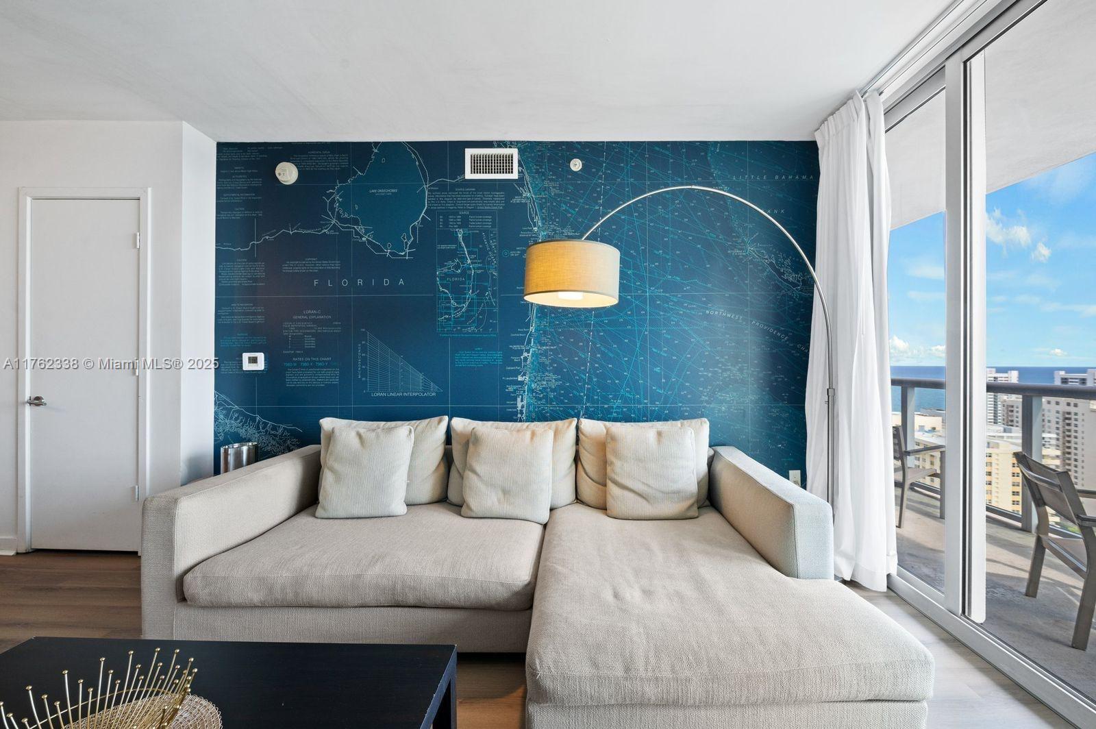 2602 East Hallandale Beach Boulevard, Unit R2703 Hallandale Beach, FL 33009 - Photo 5 of 50 a bedroom with a bed and walk in closet