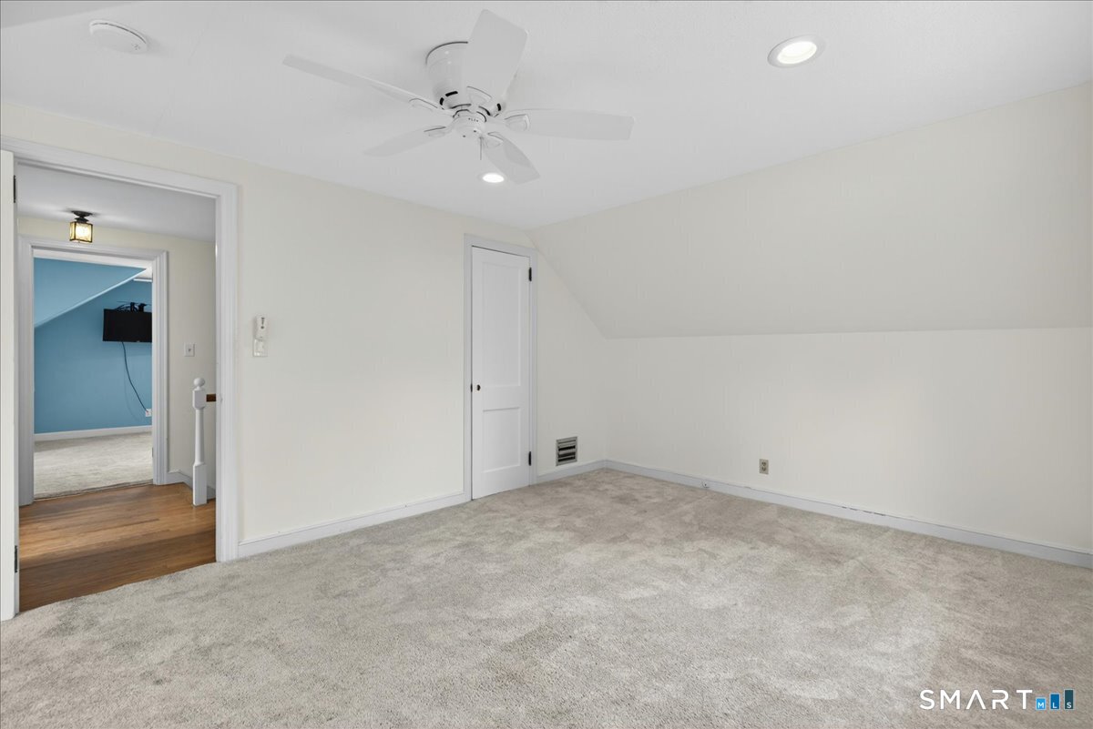 1006 King Road Cheshire, CT 06410 - Photo 22 of 40 The walk-in closet shared by both bedrooms also has access to storage space in the eaves.