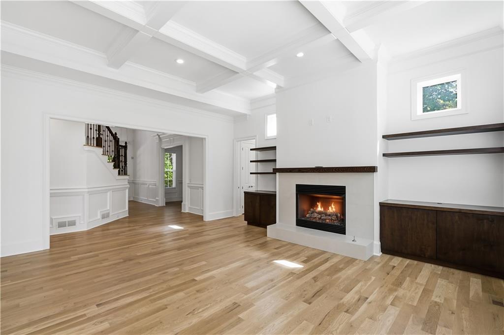 6740 Castleton Drive Northwest Sandy Springs, GA 30328 - Photo 12 of 58 a view of a livingroom with wooden floor and a fireplace