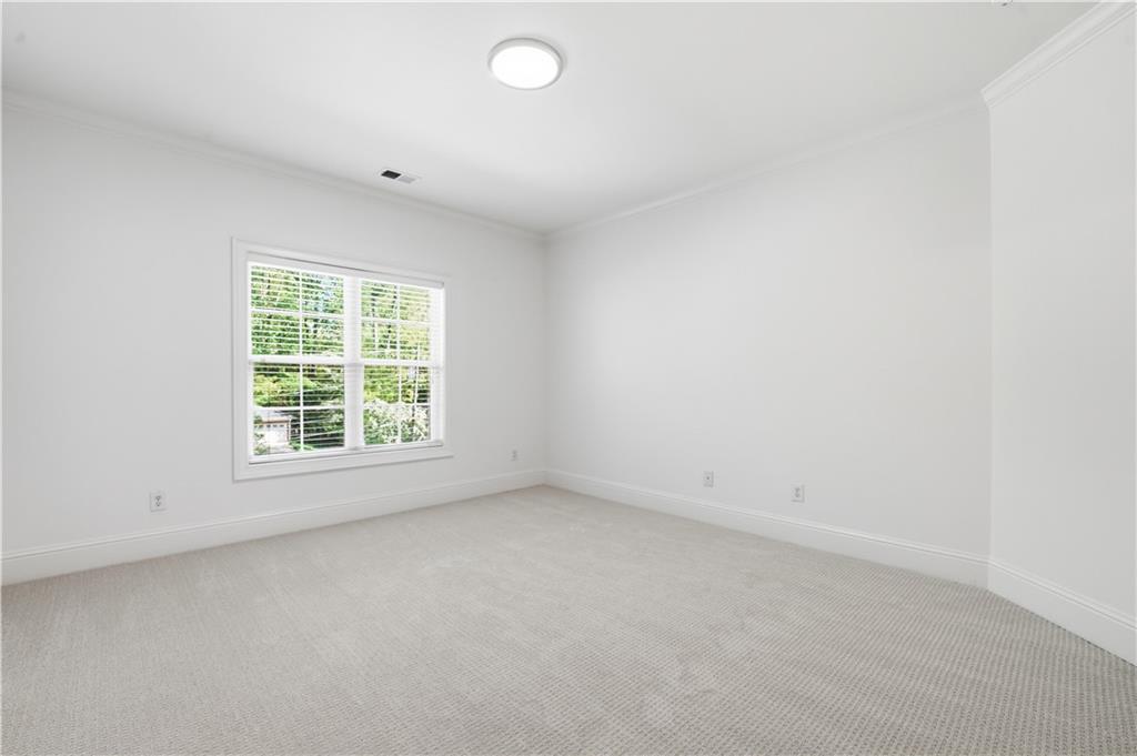 6740 Castleton Drive Northwest Sandy Springs, GA 30328 - Photo 22 of 58 an empty room with a window