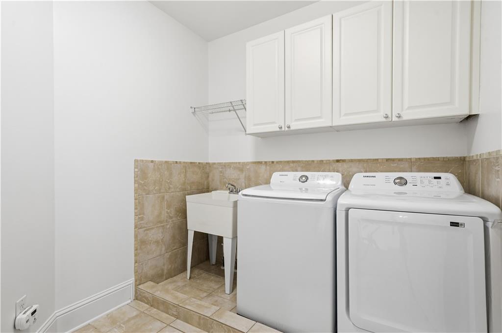 6740 Castleton Drive Northwest Sandy Springs, GA 30328 - Photo 24 of 58 a utility room with dryer and washer