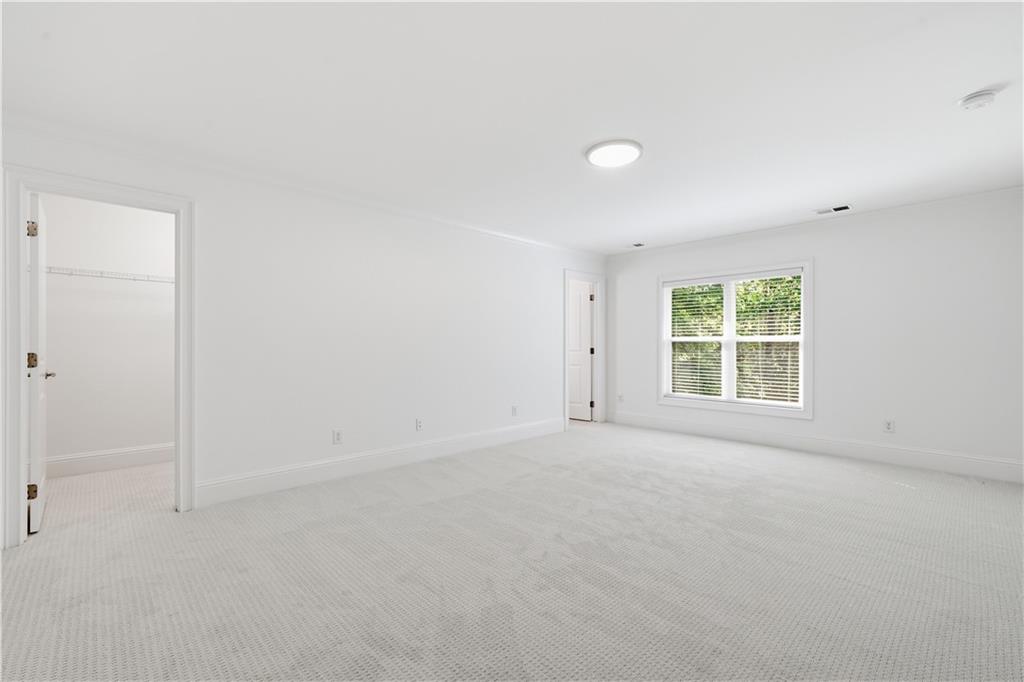 6740 Castleton Drive Northwest Sandy Springs, GA 30328 - Photo 32 of 58 an empty room with a window
