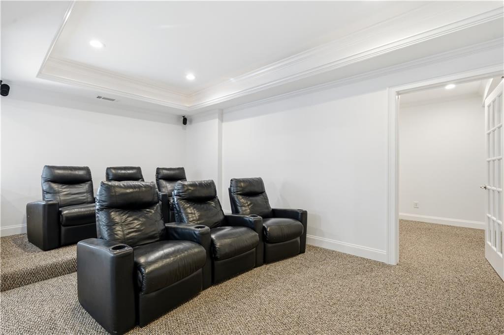 6740 Castleton Drive Northwest Sandy Springs, GA 30328 - Photo 41 of 58 a living room with furniture and a projector