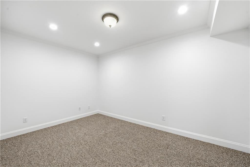 6740 Castleton Drive Northwest Sandy Springs, GA 30328 - Photo 42 of 58 an empty room with a empty space and window