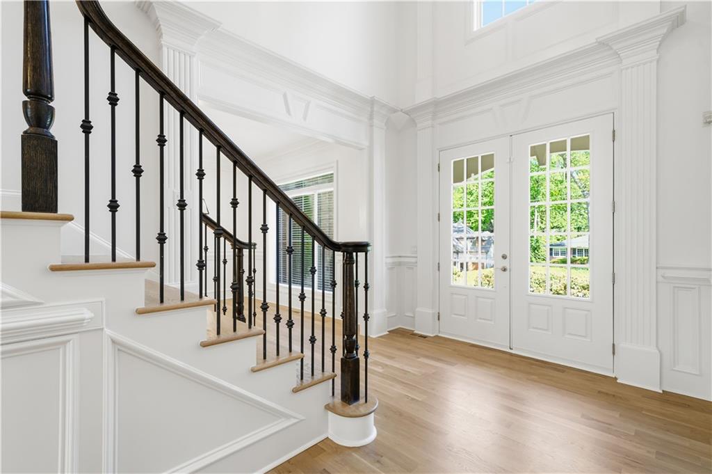 6740 Castleton Drive Northwest Sandy Springs, GA 30328 - Photo 5 of 58 a view of entryway and hall with wooden floor