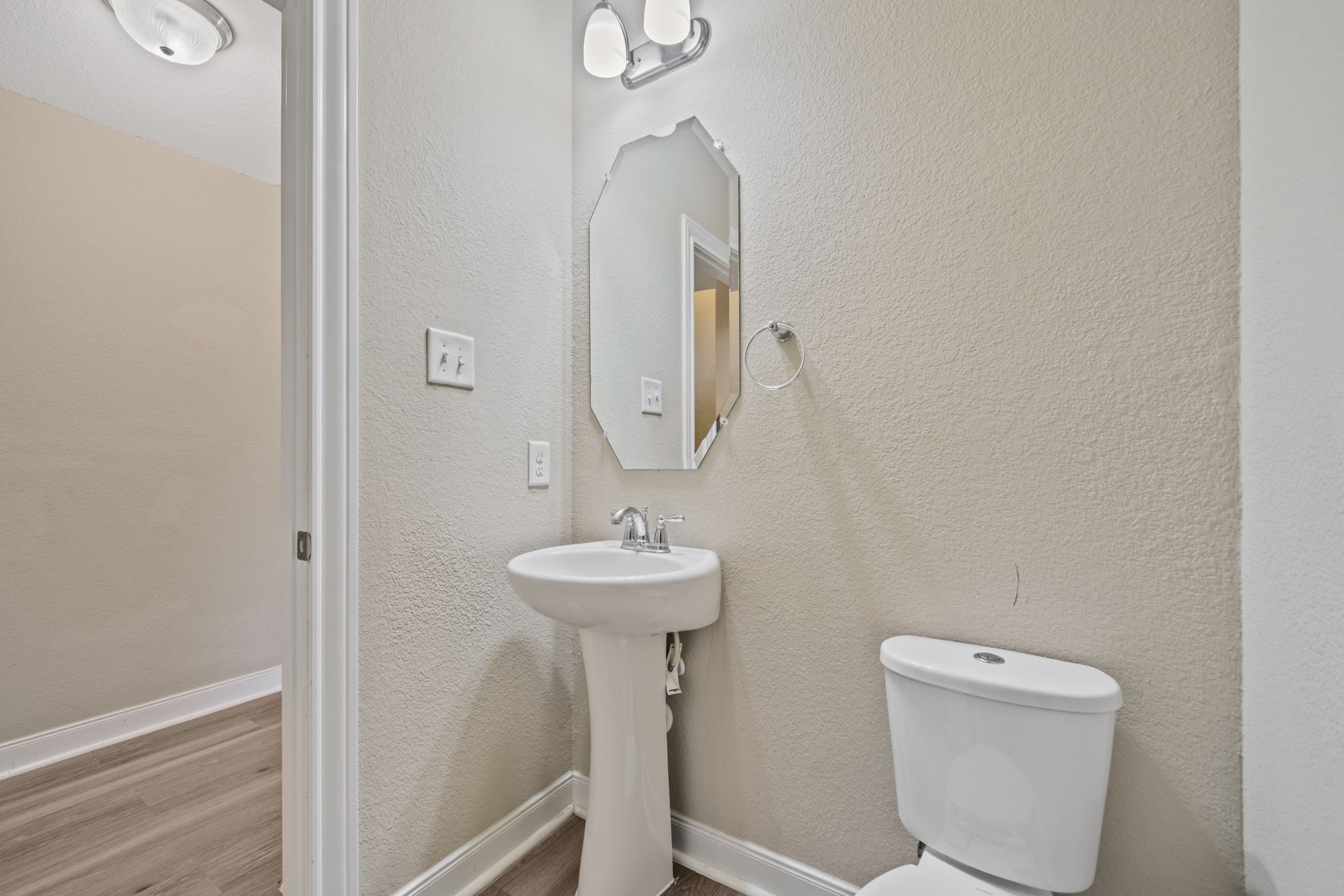 22523 Birch Ridge Meadow Drive Spring, TX 77389 - Photo 17 of 39 a bathroom with a toilet sink and mirror