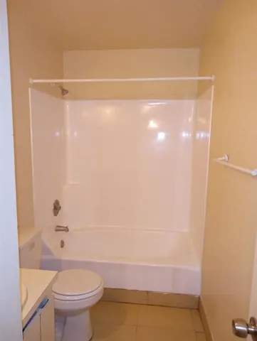 a bathroom with a shower and a toilet