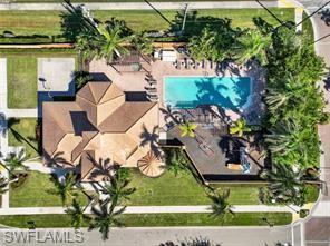 1374 Serrano Circle Naples, FL 34105 - Photo 22 of 37 an aerial view of a garden