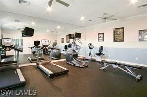 1374 Serrano Circle Naples, FL 34105 - Photo 24 of 37 a room with gym equipment and a large window