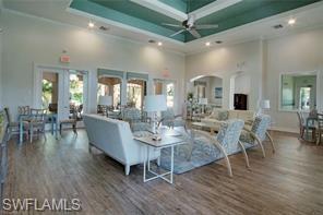 1374 Serrano Circle Naples, FL 34105 - Photo 25 of 37 a view of a dining room with furniture and wooden floor
