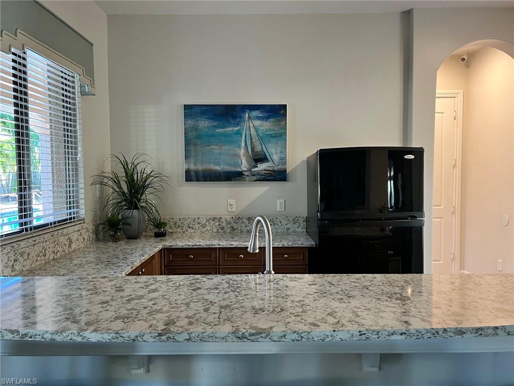 1374 Serrano Circle Naples, FL 34105 - Photo 30 of 37 a bathroom with sink bathtub and mirror