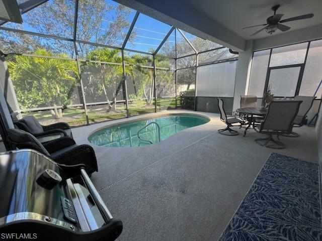 1374 Serrano Circle Naples, FL 34105 - Photo 35 of 37 a view of a swimming pool with a lounge chair