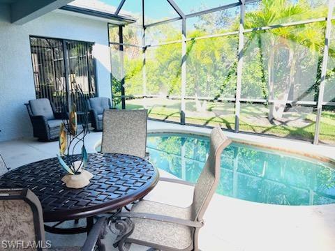 1374 Serrano Circle Naples, FL 34105 - Photo 36 of 37 a view of a dining room with furniture window and outside view