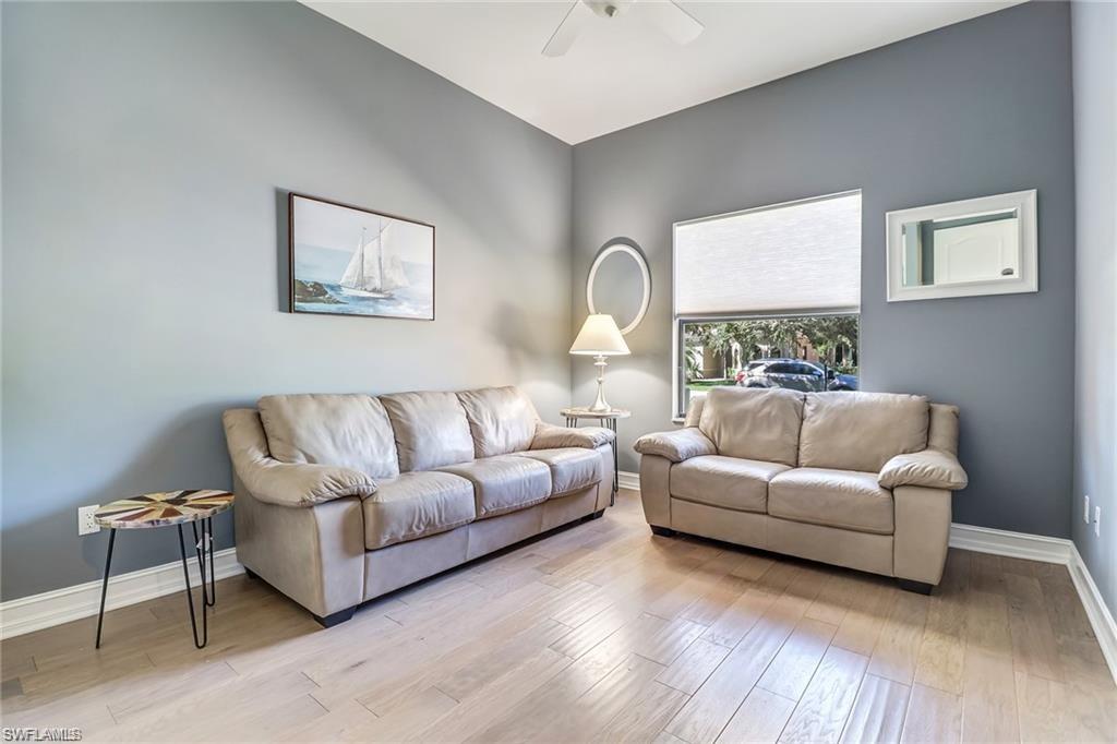 1374 Serrano Circle Naples, FL 34105 - Photo 6 of 37 a living room with furniture and a large window