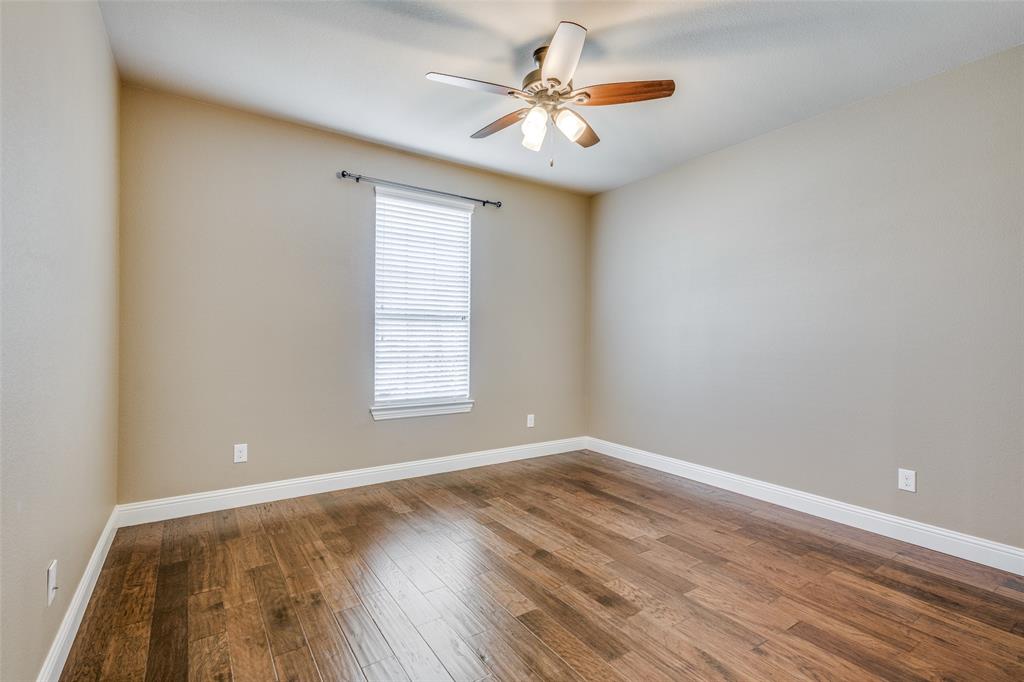 2143 Canyon Road Celina, TX 75009 - Photo 26 of 39 wooden floor in an empty room with a window