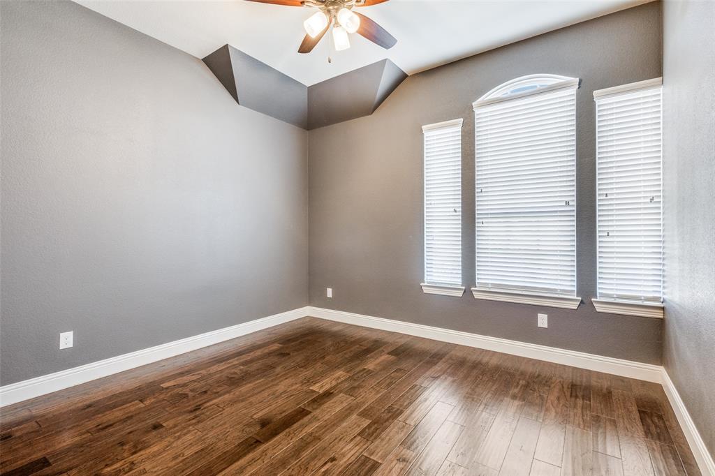 2143 Canyon Road Celina, TX 75009 - Photo 27 of 39 an empty room with wooden floor and windows