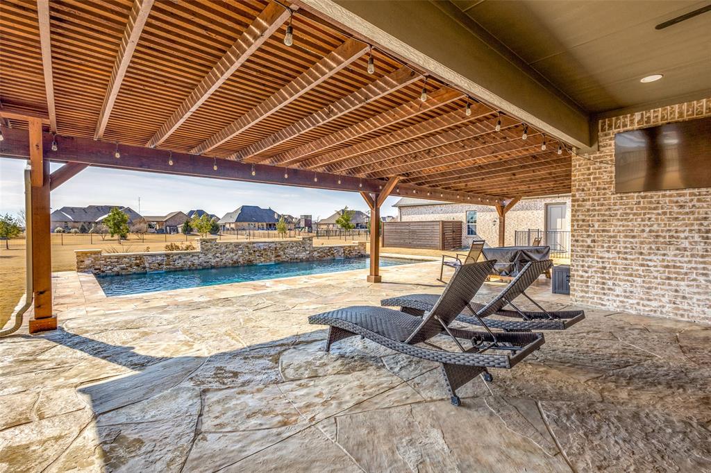 2143 Canyon Road Celina, TX 75009 - Photo 34 of 39 a view of a swimming pool with a patio
