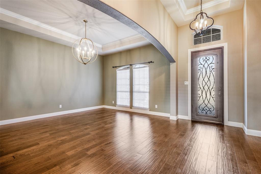 2143 Canyon Road Celina, TX 75009 - Photo 7 of 39 a view of an empty room with wooden floor and a window