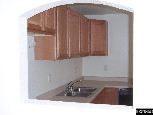 45 Volmer Way Reno, NV 89512 - Photo 5 of 9 a kitchen with a sink and cabinets