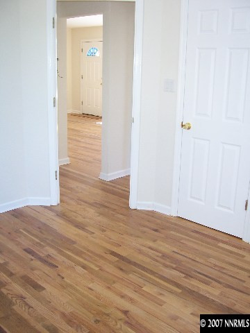 45 Volmer Way Reno, NV 89512 - Photo 6 of 9 a view of a hallway with wooden floor