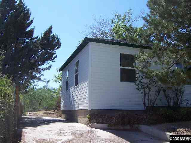 45 Volmer Way Reno, NV 89512 - Photo 8 of 9 a front view of a house with a yard