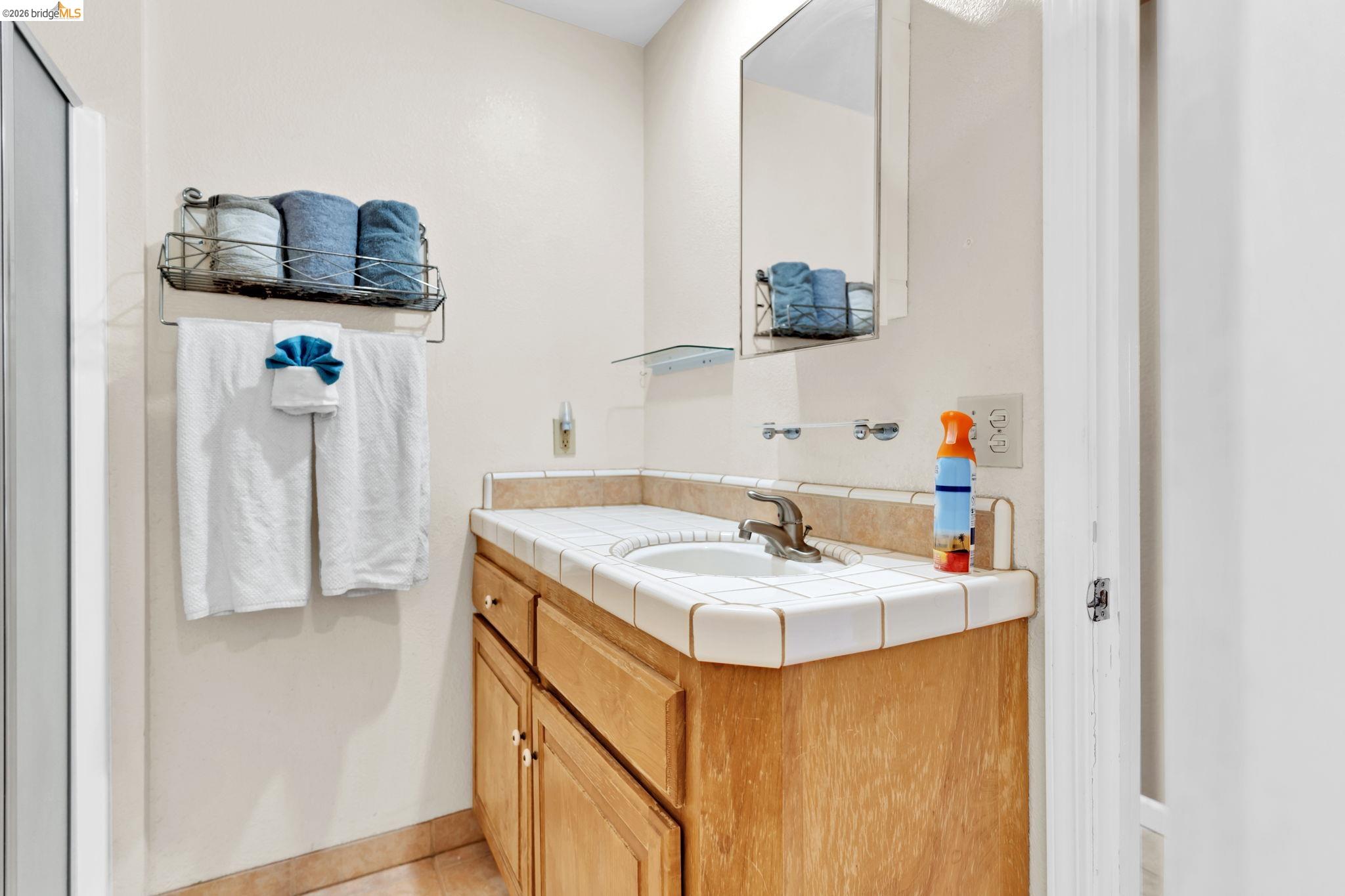 14799 Big Hill Road Sonora, CA 95370 - Photo 49 of 60 Bathroom featuring vanity and light tile patterned floors