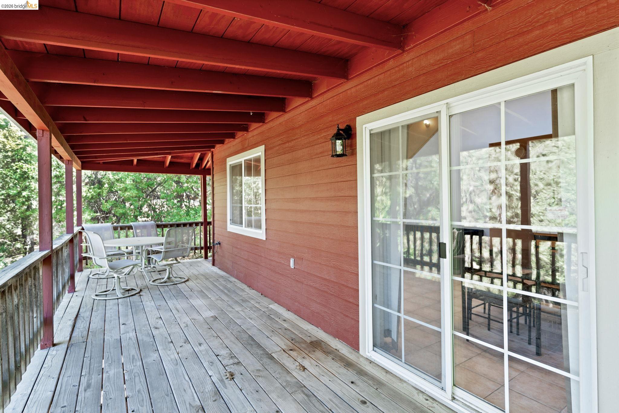 14799 Big Hill Road Sonora, CA 95370 - Photo 55 of 60 Wooden terrace with outdoor dining area