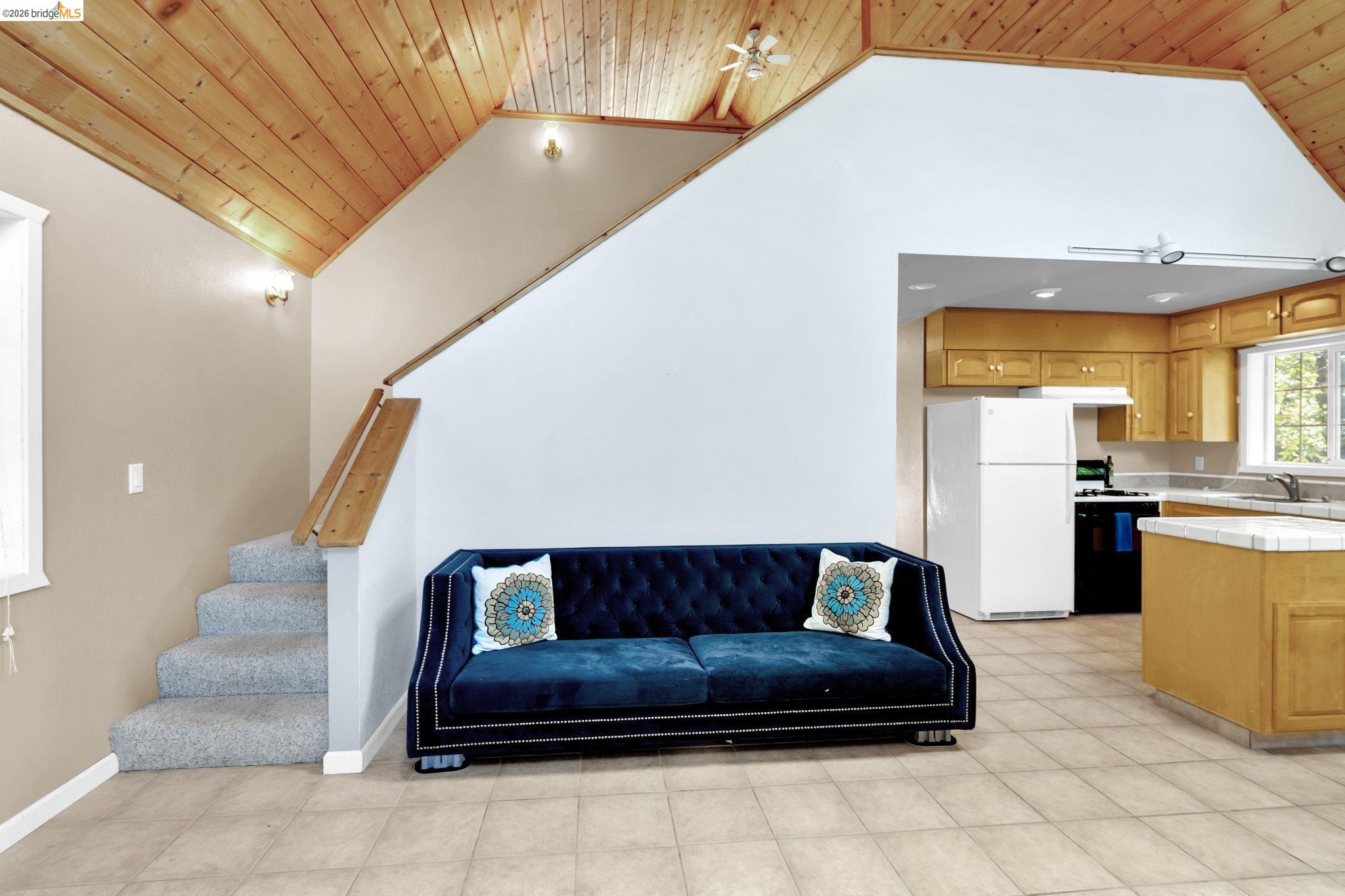 14799 Big Hill Road Sonora, CA 95370 - Photo 56 of 60 Living area with a vaulted wood ceiling and ceiling fan