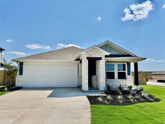a front view of house with garden