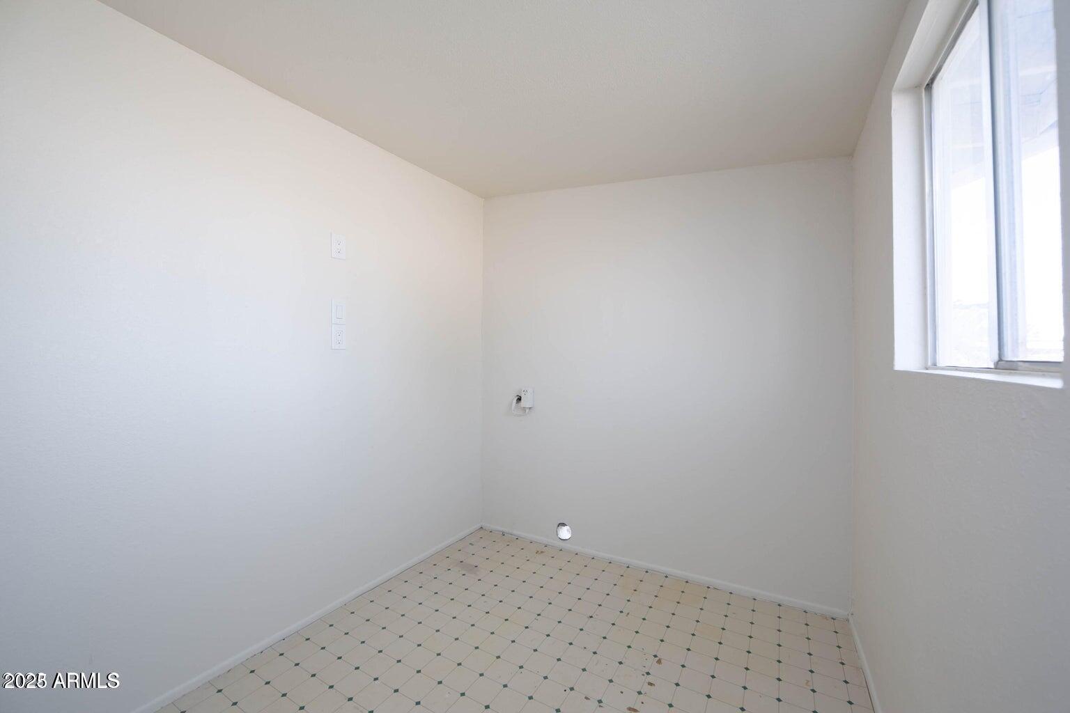 310 2nd Street Huachuca City, AZ 85616 - Photo 11 of 19 a view of a small space with wooden floor and a window