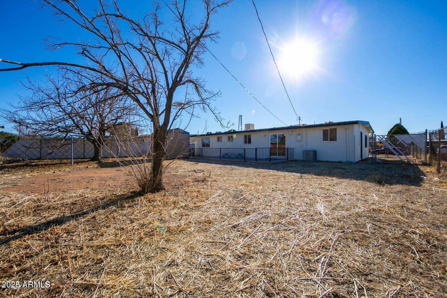 310 2nd Street Huachuca City, AZ 85616 - Photo 14 of 19 a view of a yard with a house