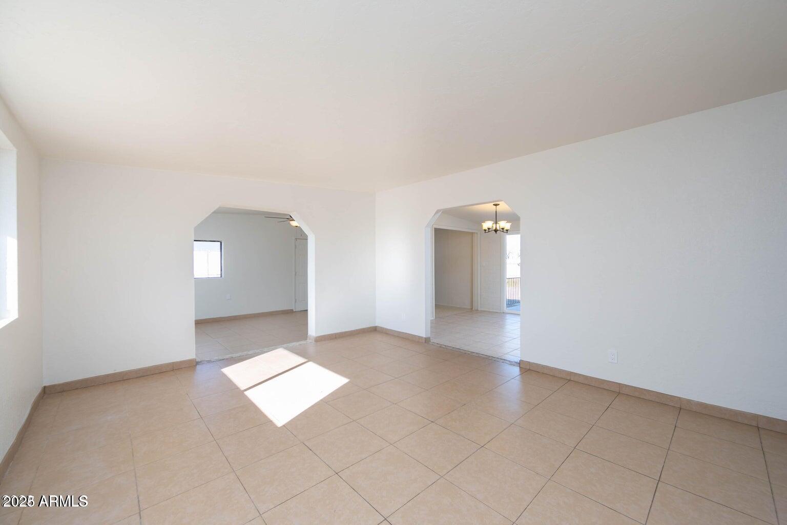 310 2nd Street Huachuca City, AZ 85616 - Photo 2 of 19 an empty room with windows