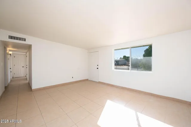 an empty room with windows