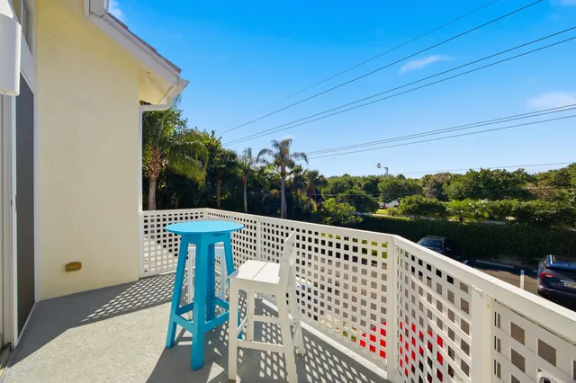 a view of a lobby with a patio and a garden