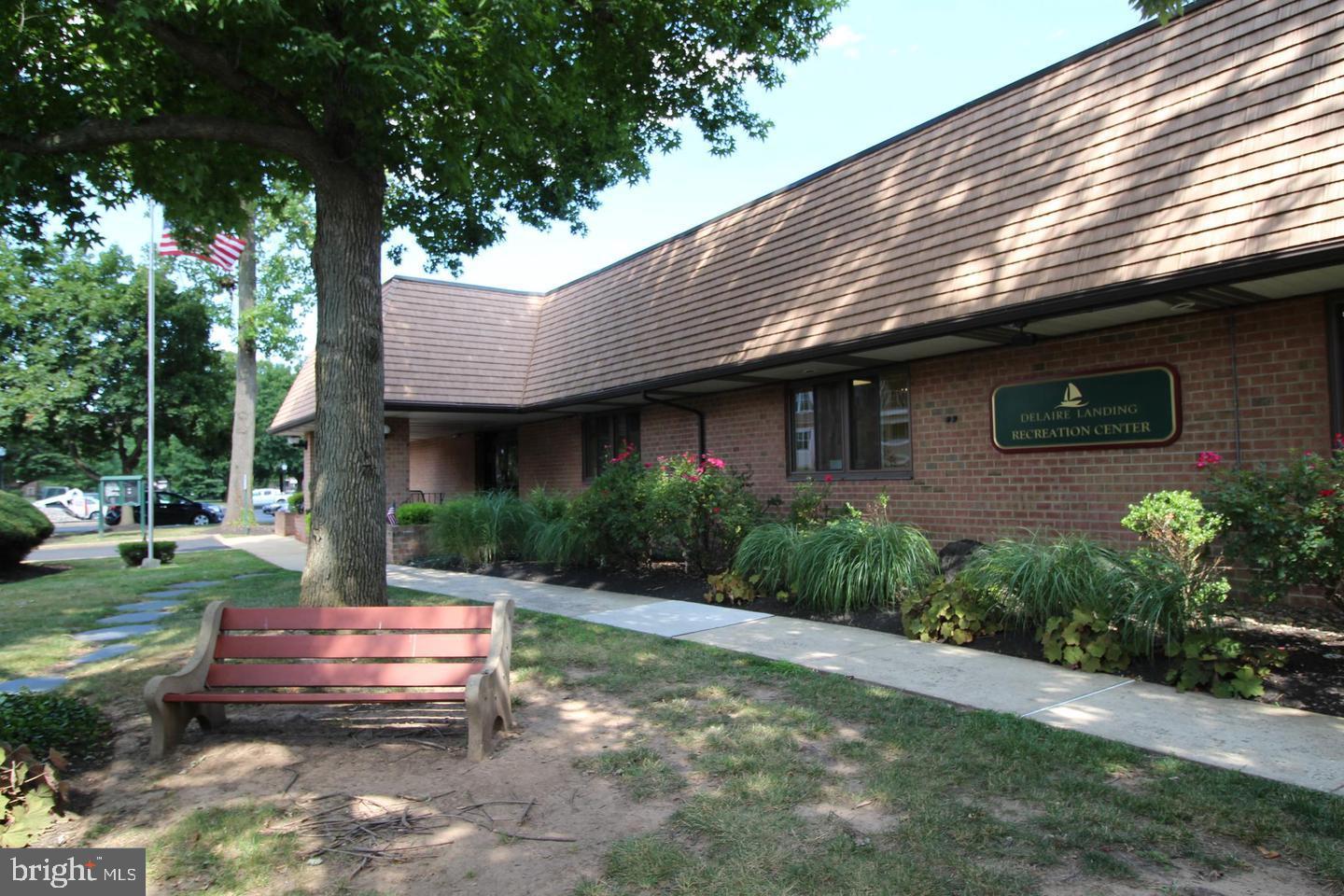 62204 Delaire Landing Road, Unit 204 Philadelphia, PA 19114 - Photo 20 of 29 a front view of a house with a garden