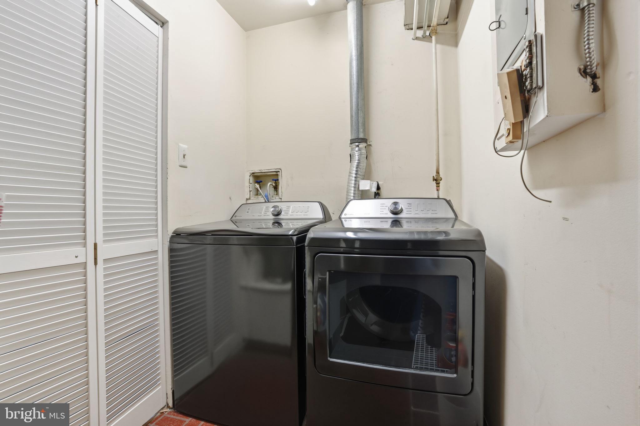 62204 Delaire Landing Road, Unit 204 Philadelphia, PA 19114 - Photo 24 of 35 a bathroom with a sink and a washing machine