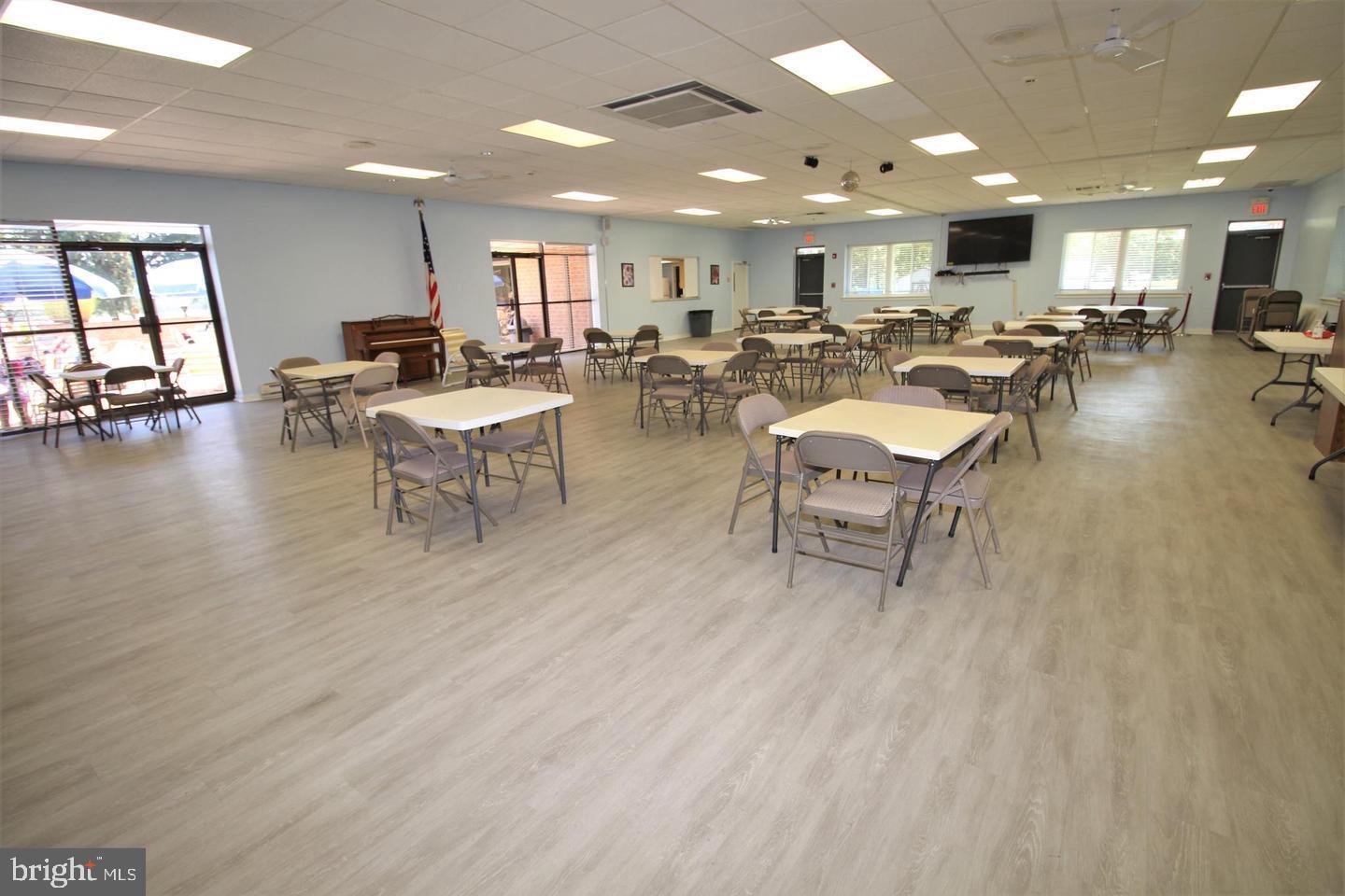 62204 Delaire Landing Road, Unit 204 Philadelphia, PA 19114 - Photo 25 of 29 a living room with lots of furniture and a table