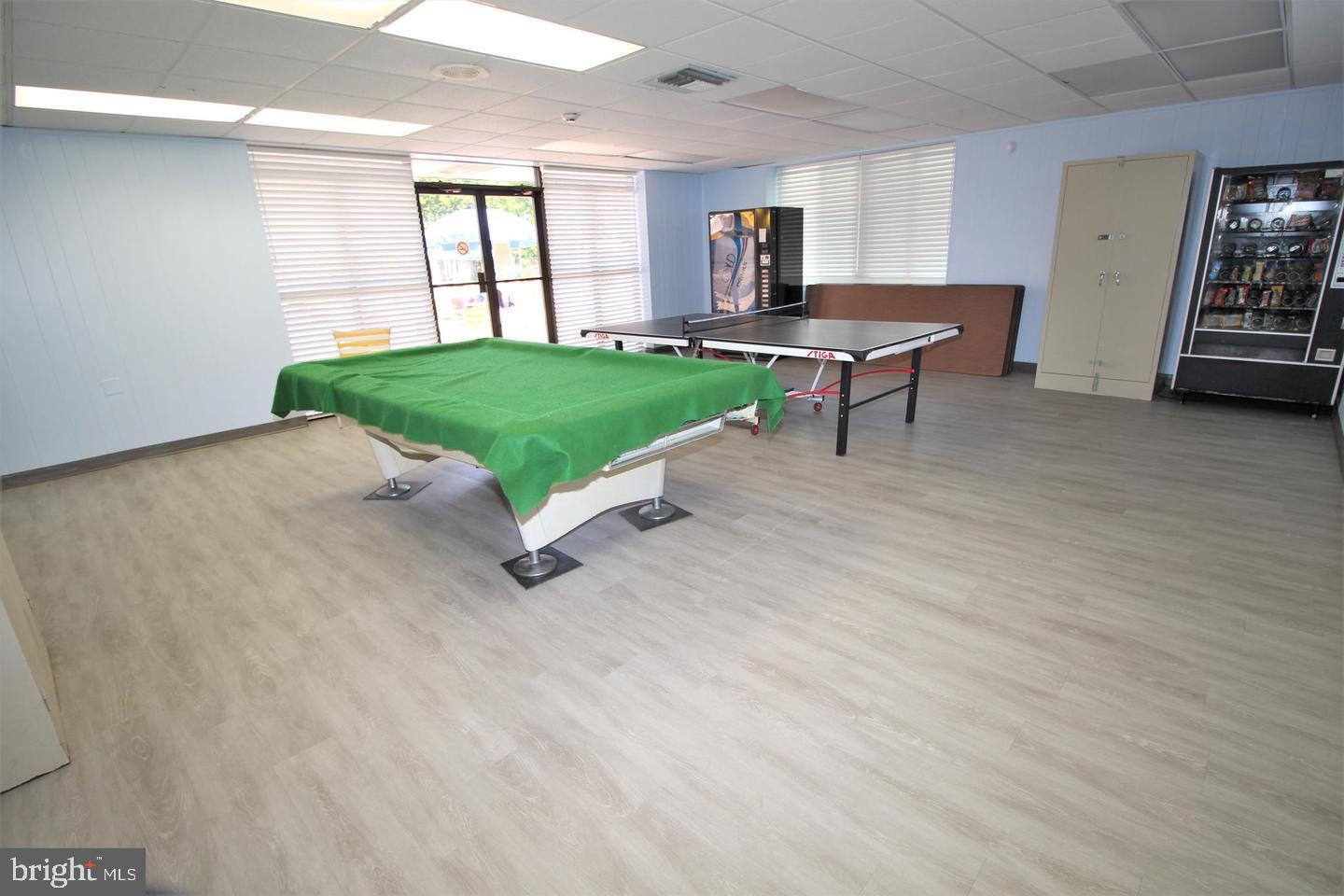 62204 Delaire Landing Road, Unit 204 Philadelphia, PA 19114 - Photo 26 of 29 a living room with furniture and a table