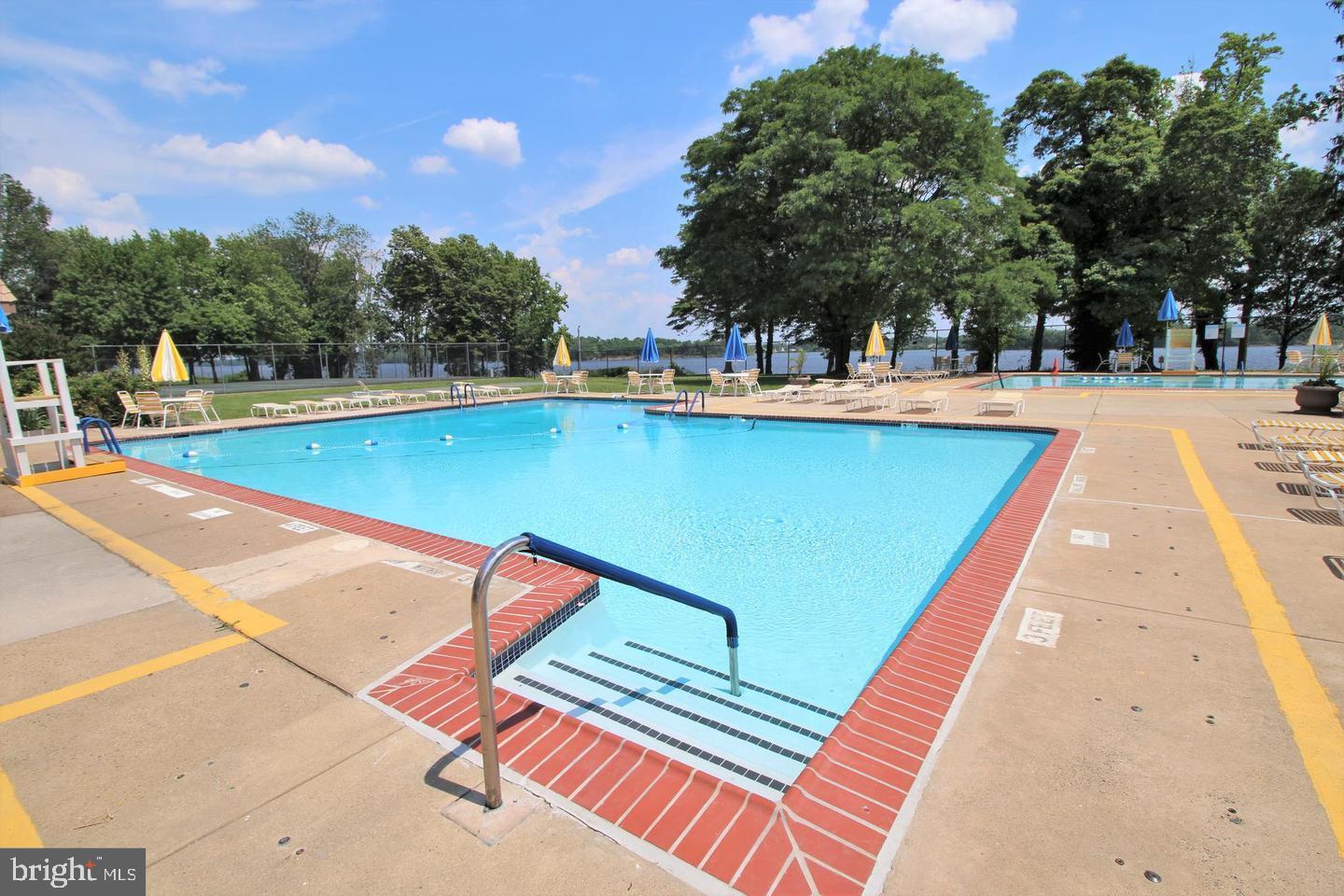 62204 Delaire Landing Road, Unit 204 Philadelphia, PA 19114 - Photo 28 of 29 a view of swimming pool with a patio and a yard