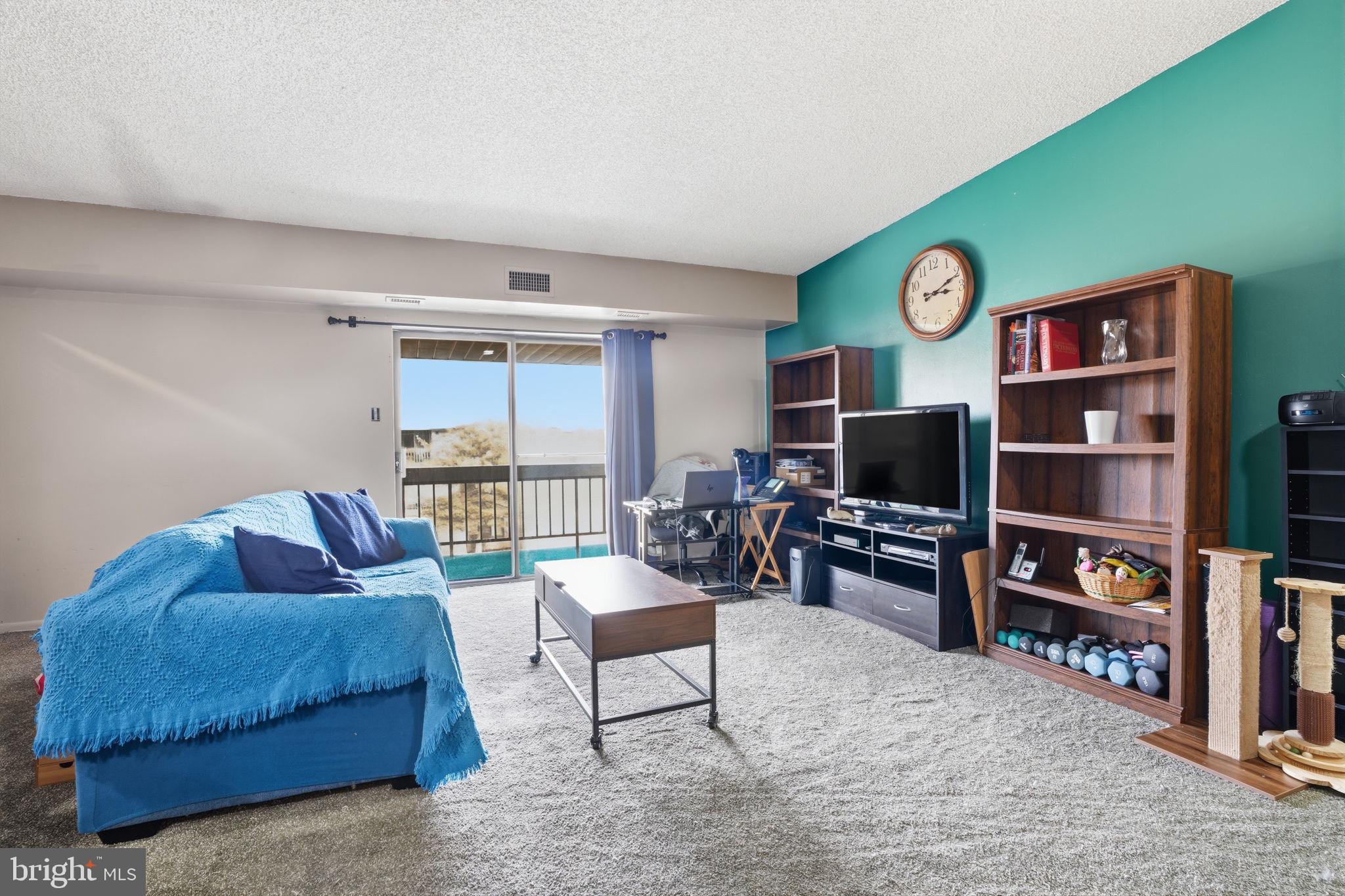 62204 Delaire Landing Road, Unit 204 Philadelphia, PA 19114 - Photo 4 of 29 a living room with furniture workspace and a flat screen tv
