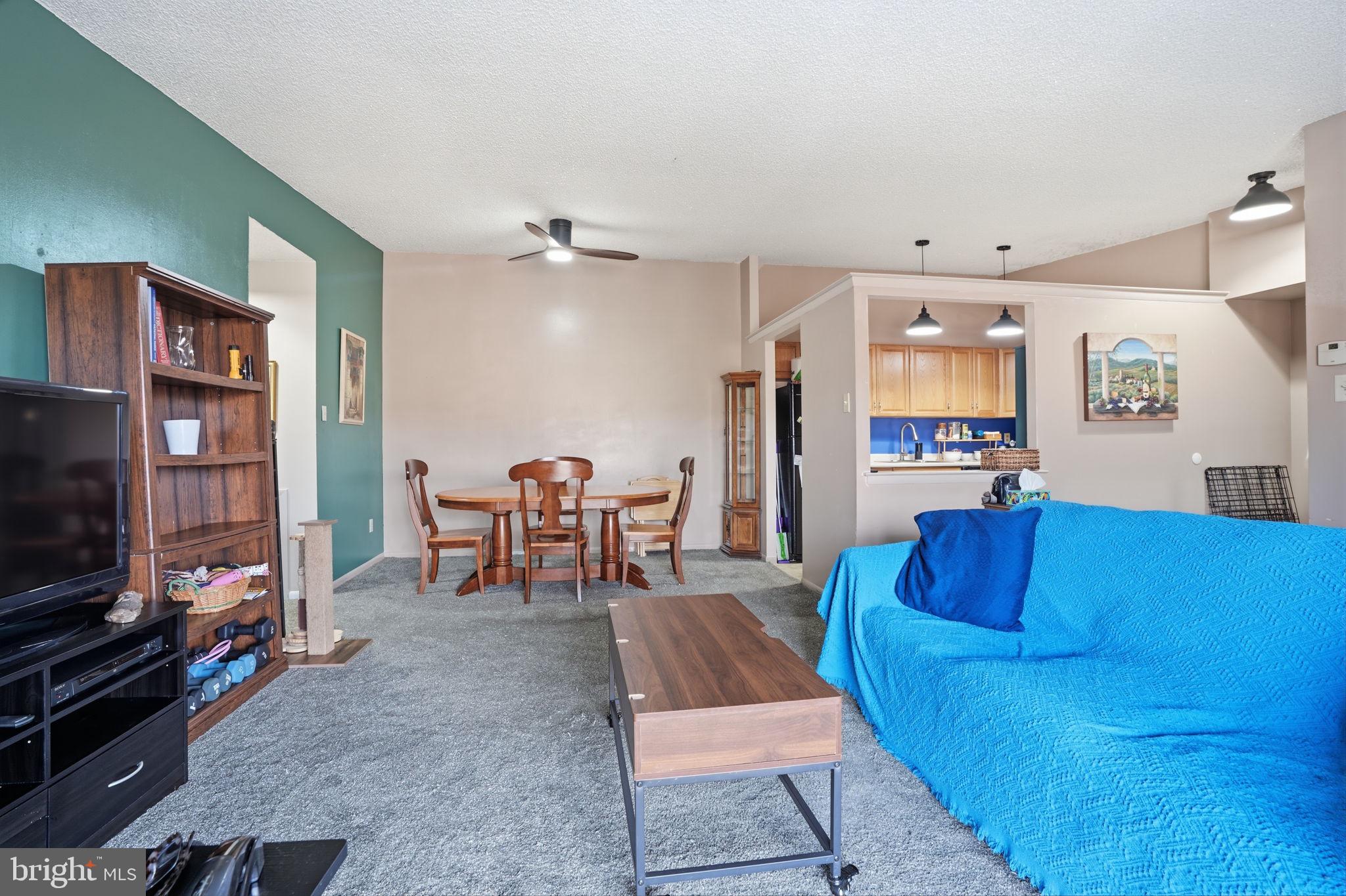 62204 Delaire Landing Road, Unit 204 Philadelphia, PA 19114 - Photo 5 of 29 a living room with furniture and a flat screen tv