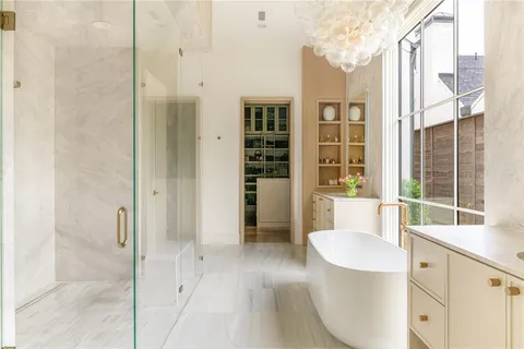 a spacious bathroom with a granite countertop sink and a mirror