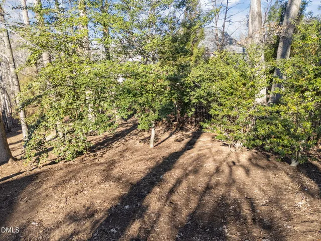 a view of a dining room with furniture wooden floor and a chandelier