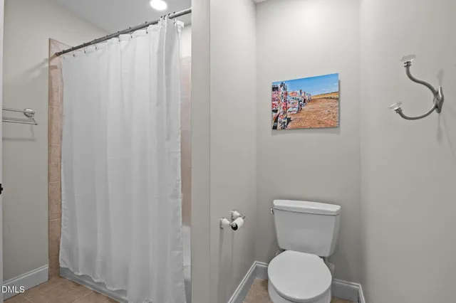 an aerial view of a tennis ground with large trees
